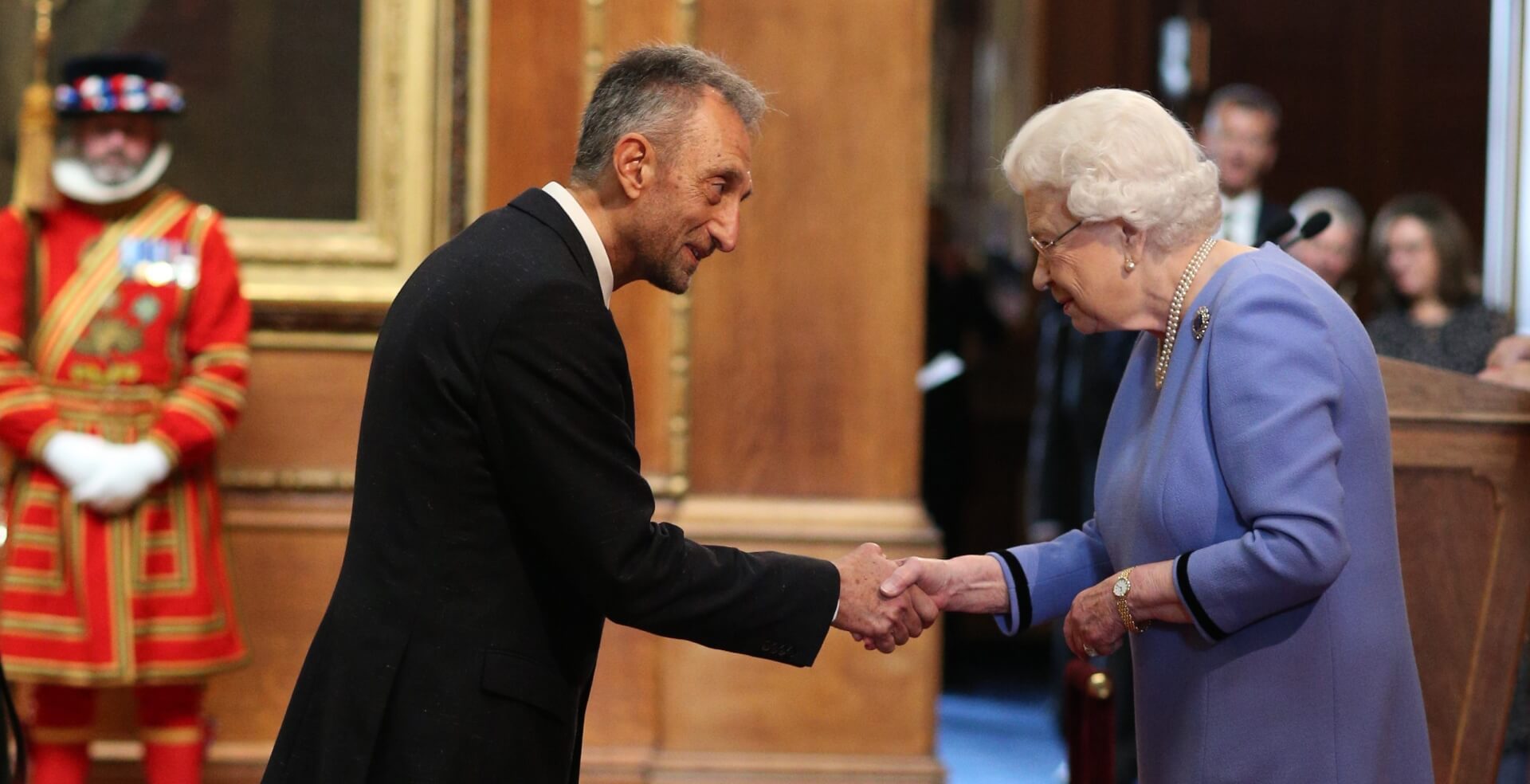 Dr. Mike Ashmead is made an OBE (Officer of the Order of the British Empire) by Queen Elizabeth II at Windsor Castle. Photo credit Jonathan Brady/PA Wire